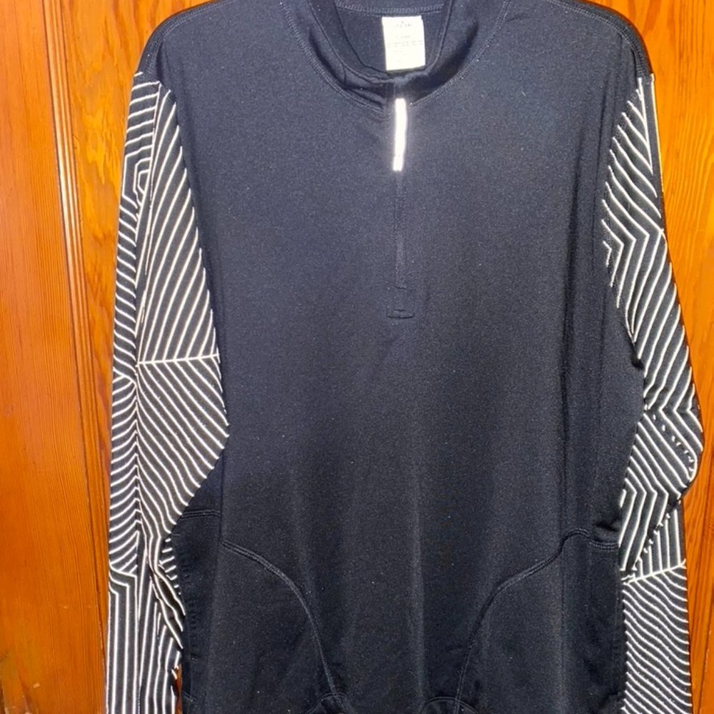 Avia reflective running pants and jacket. Black/spider web design. Size L.